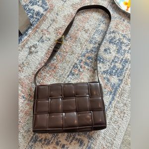 Brown woven vegan leather crossbody.